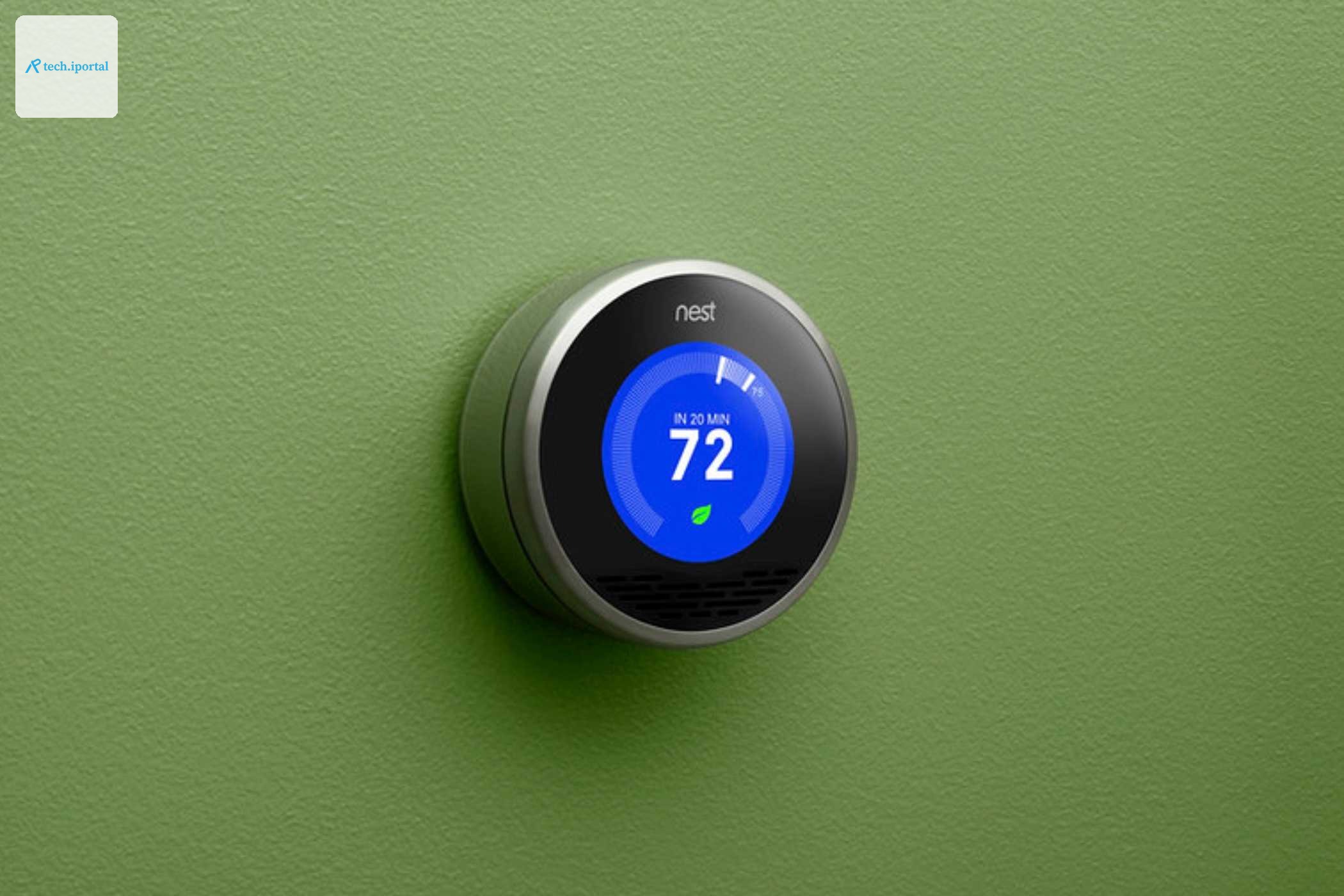 A first-generation Nest learning thermostat in a press image.