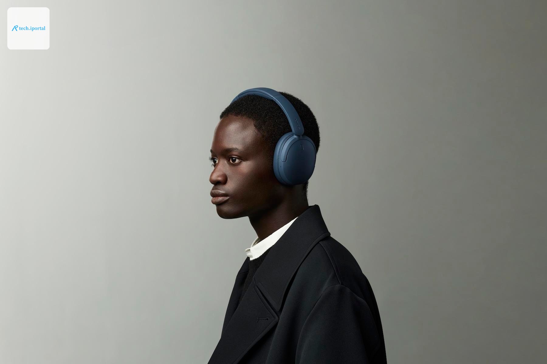 A person wearing the blue Sony WH-CH730N headphones.