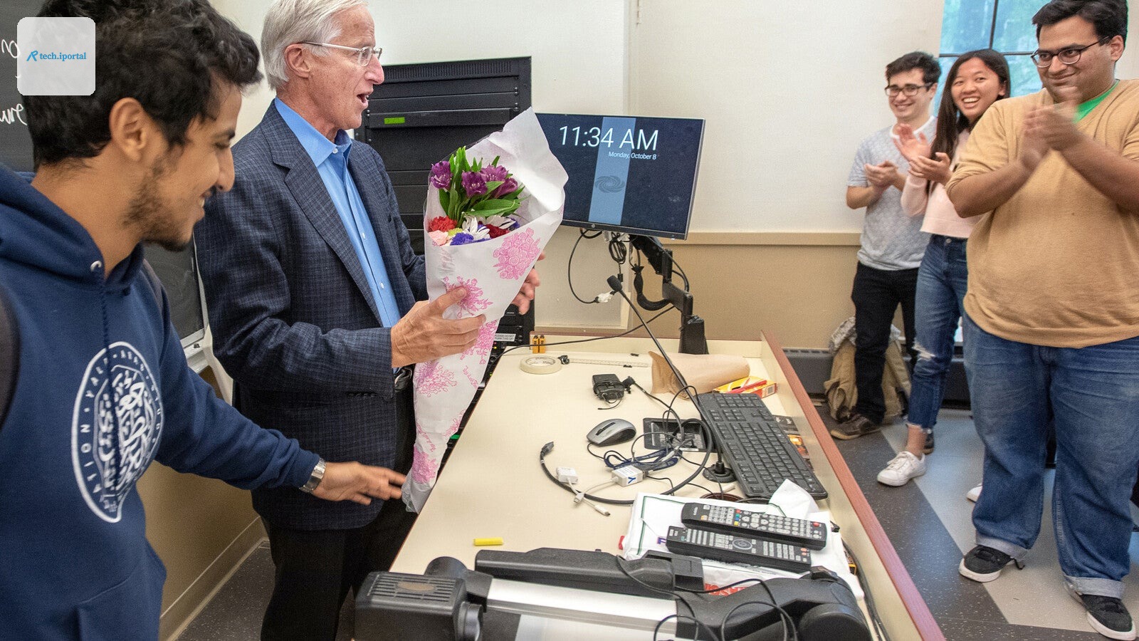 Nordhaus receiving a bouquet from students.