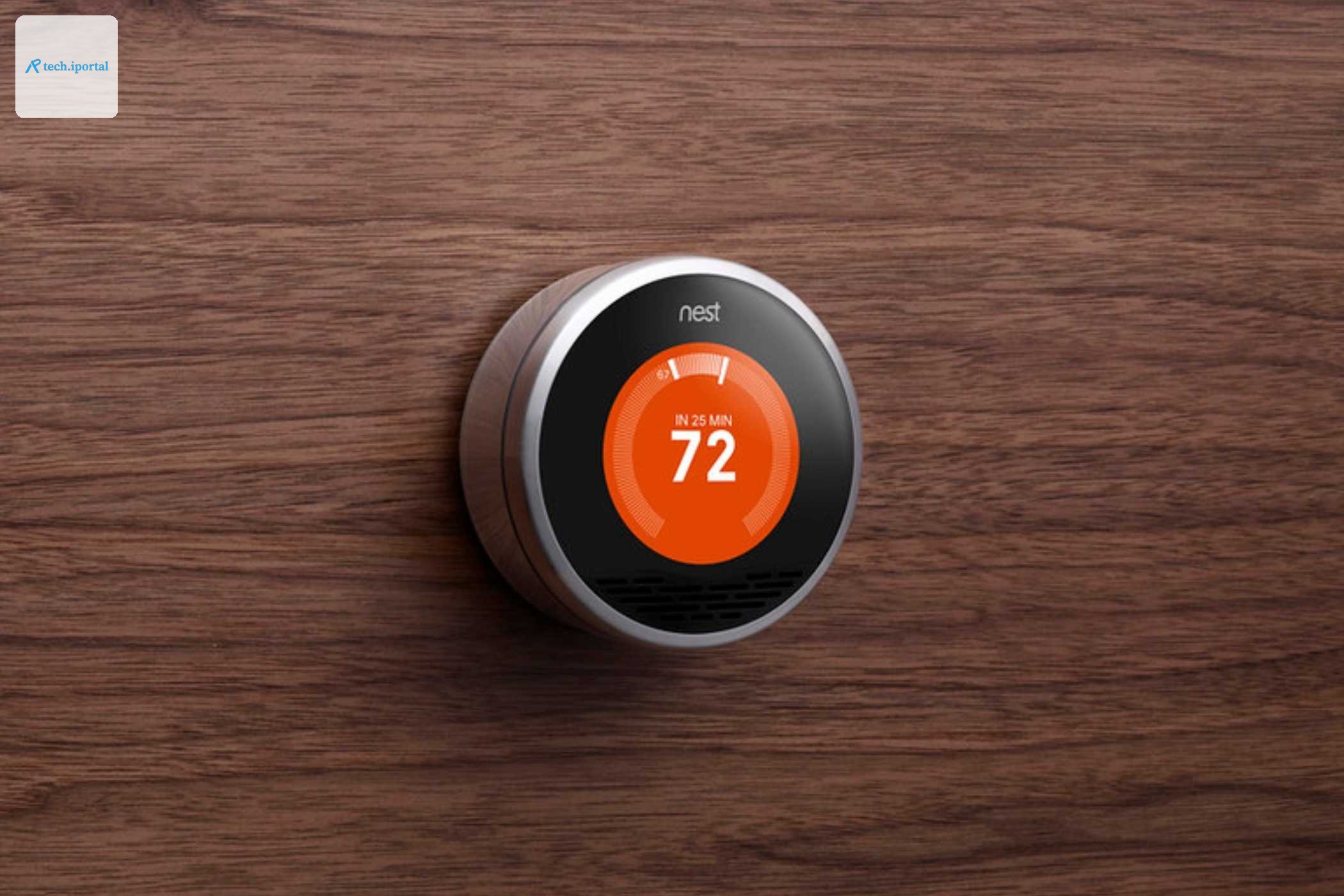 A first-generation Nest learning thermostat in a press image.