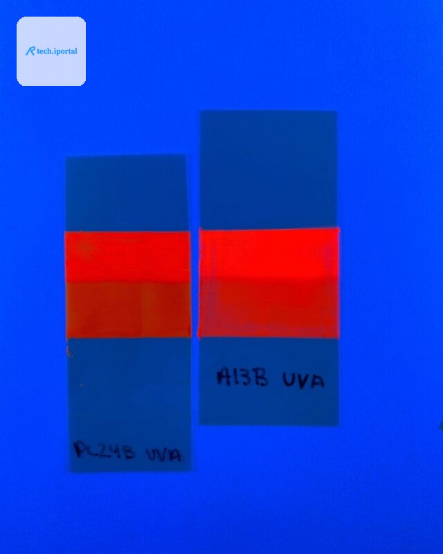 The darkening on the bottom half of these fluorescent tape strips shows that the optical brightener in the tape degraded faster than the pigmentary color when exposed to light. The top half of the str