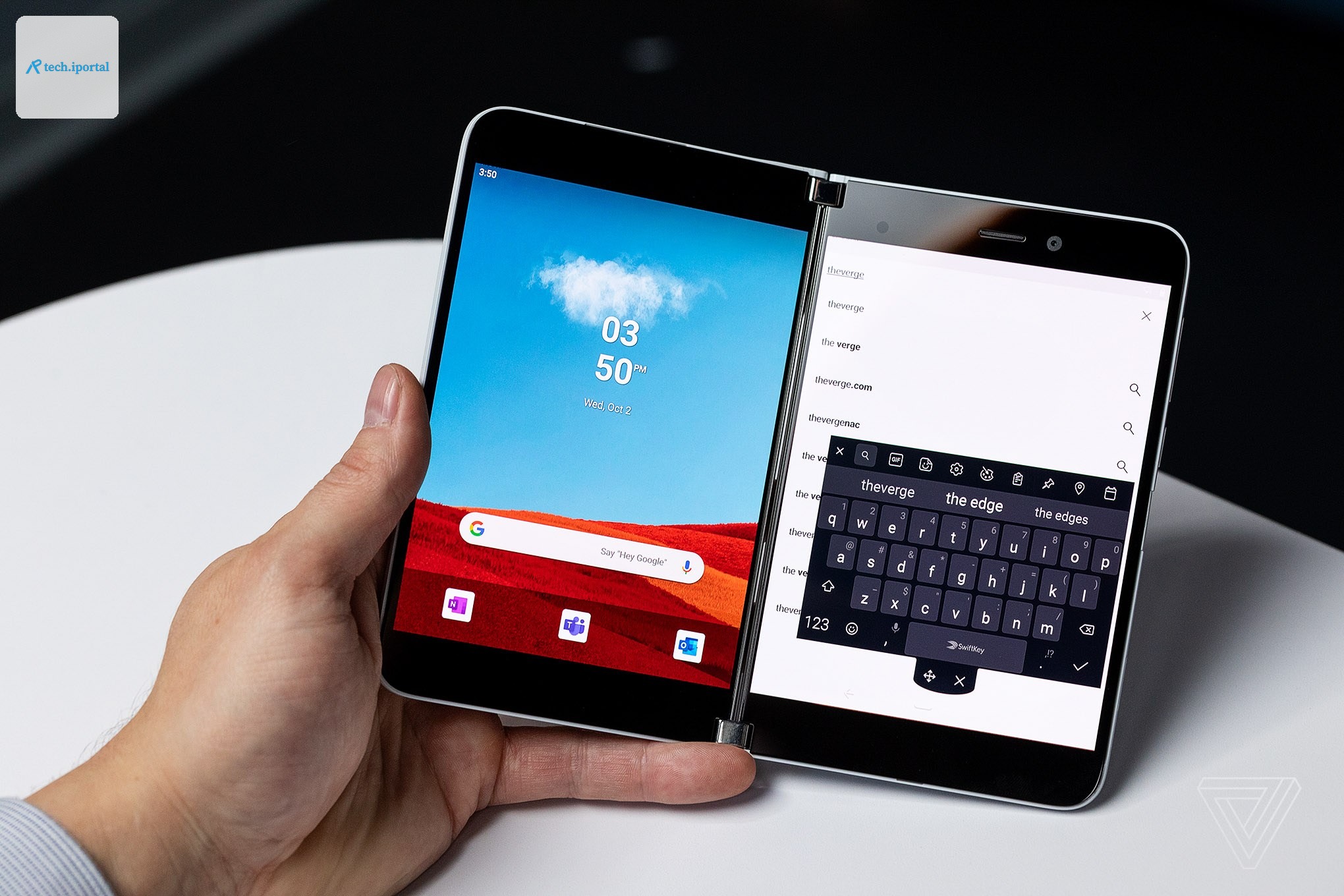 A person holding the Microsoft Surface Duo smartphone in one hand.