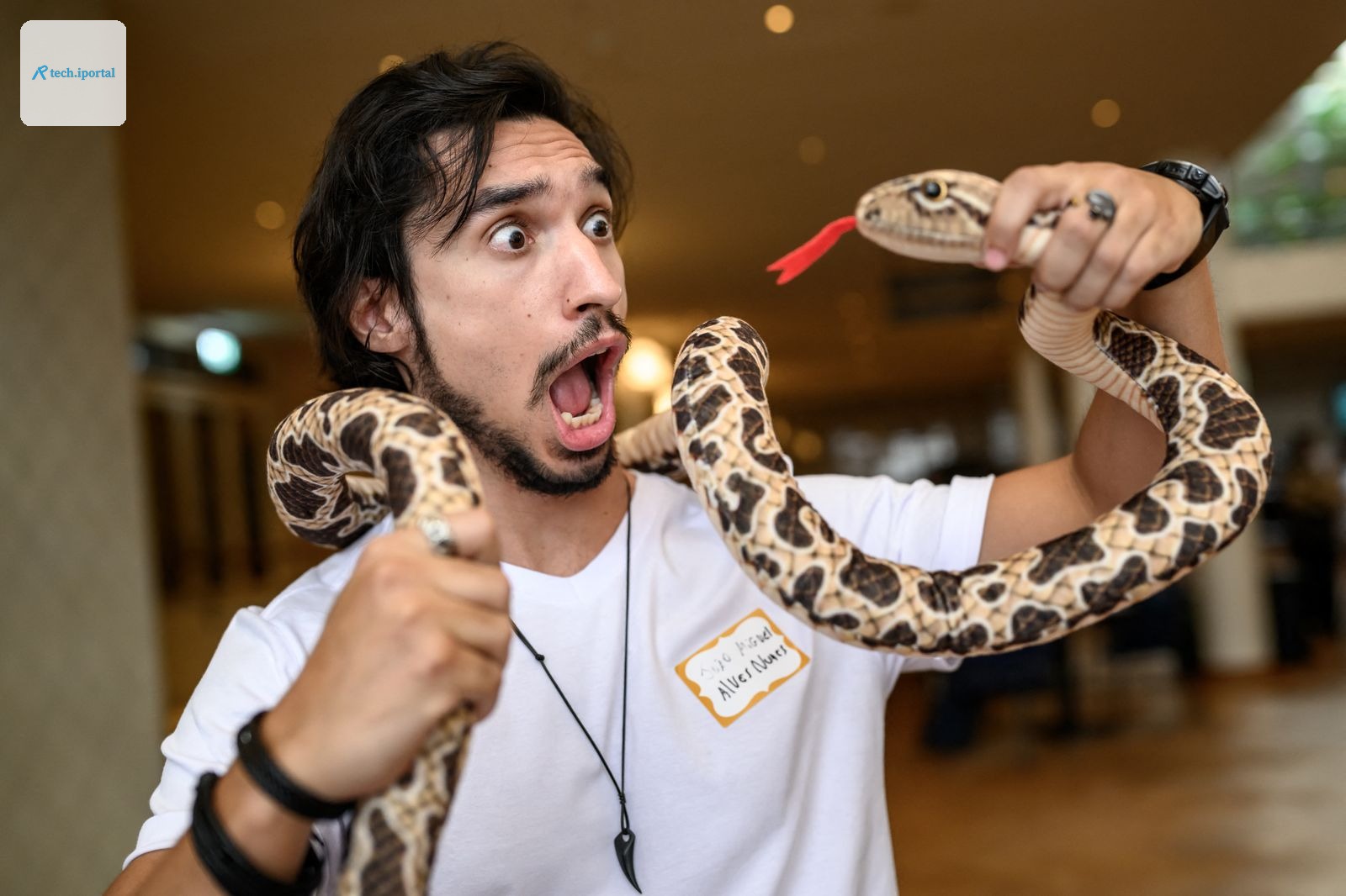 Brazilian biologist Joao Miguel AlvesNunes poses with a fake snake ahead of the 2026 Ig Nobel Prize Ceremony in Zurich...