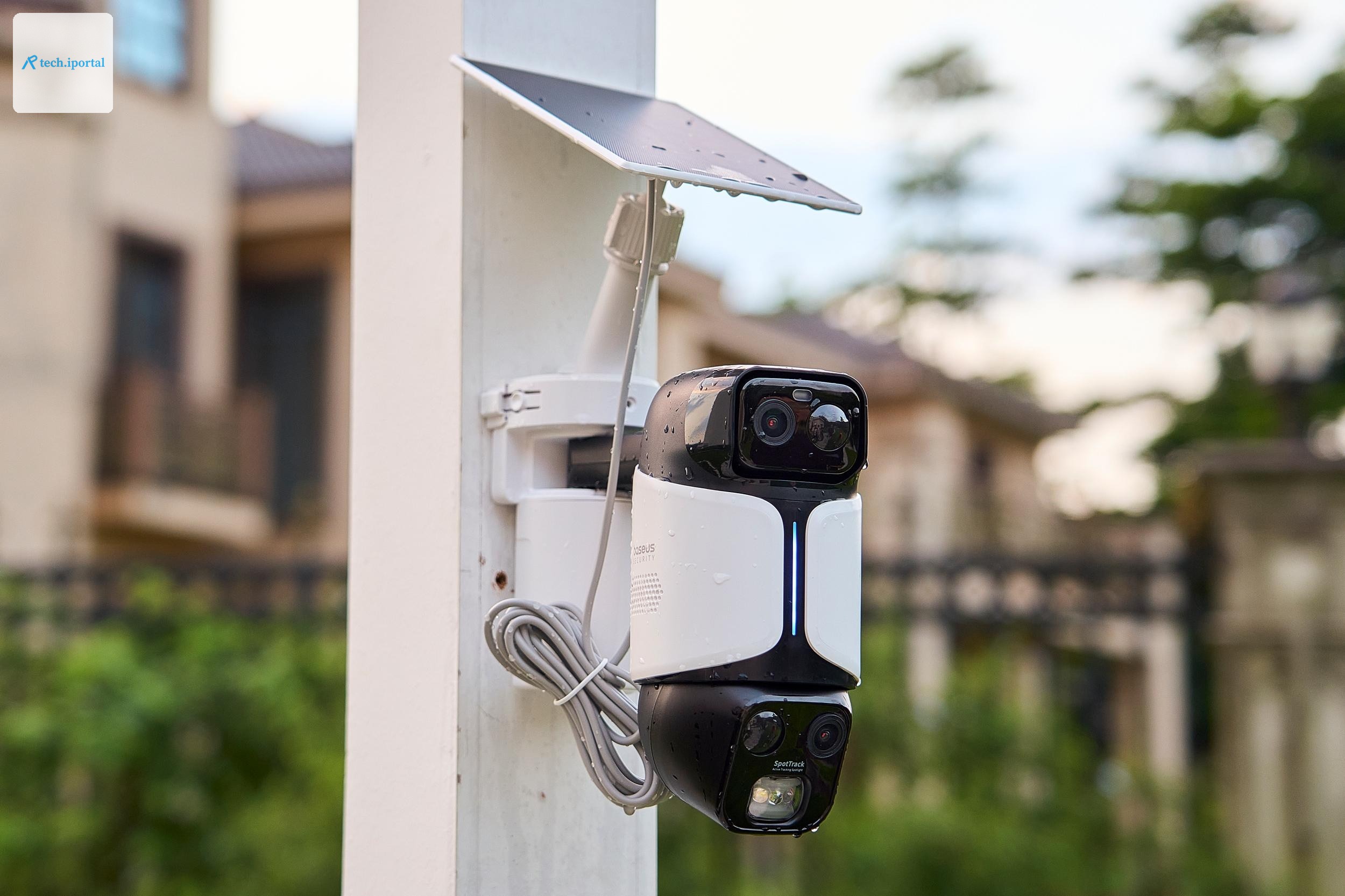 The Baseus U2 Pro security camera mounted to a wooden post in a backyard.