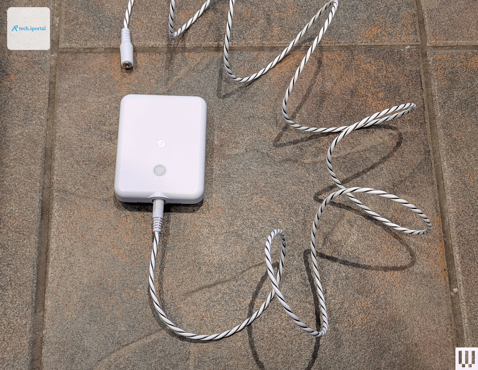 Image may contain Rope Adapter Electronics Hardware and Phone