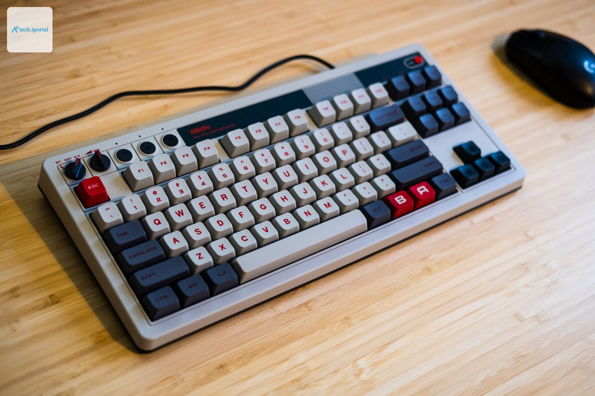 8BitDo retro keyboard with mouse next to it.