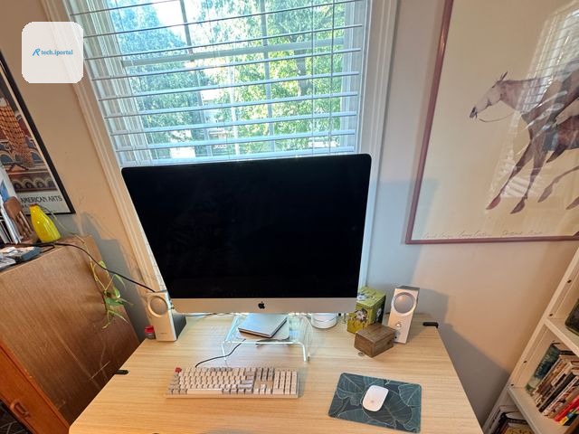 Image may contain Furniture Table Hardwood Stained Wood Wood Desk Electronics Speaker and Computer