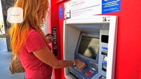 Woman at a cash machine