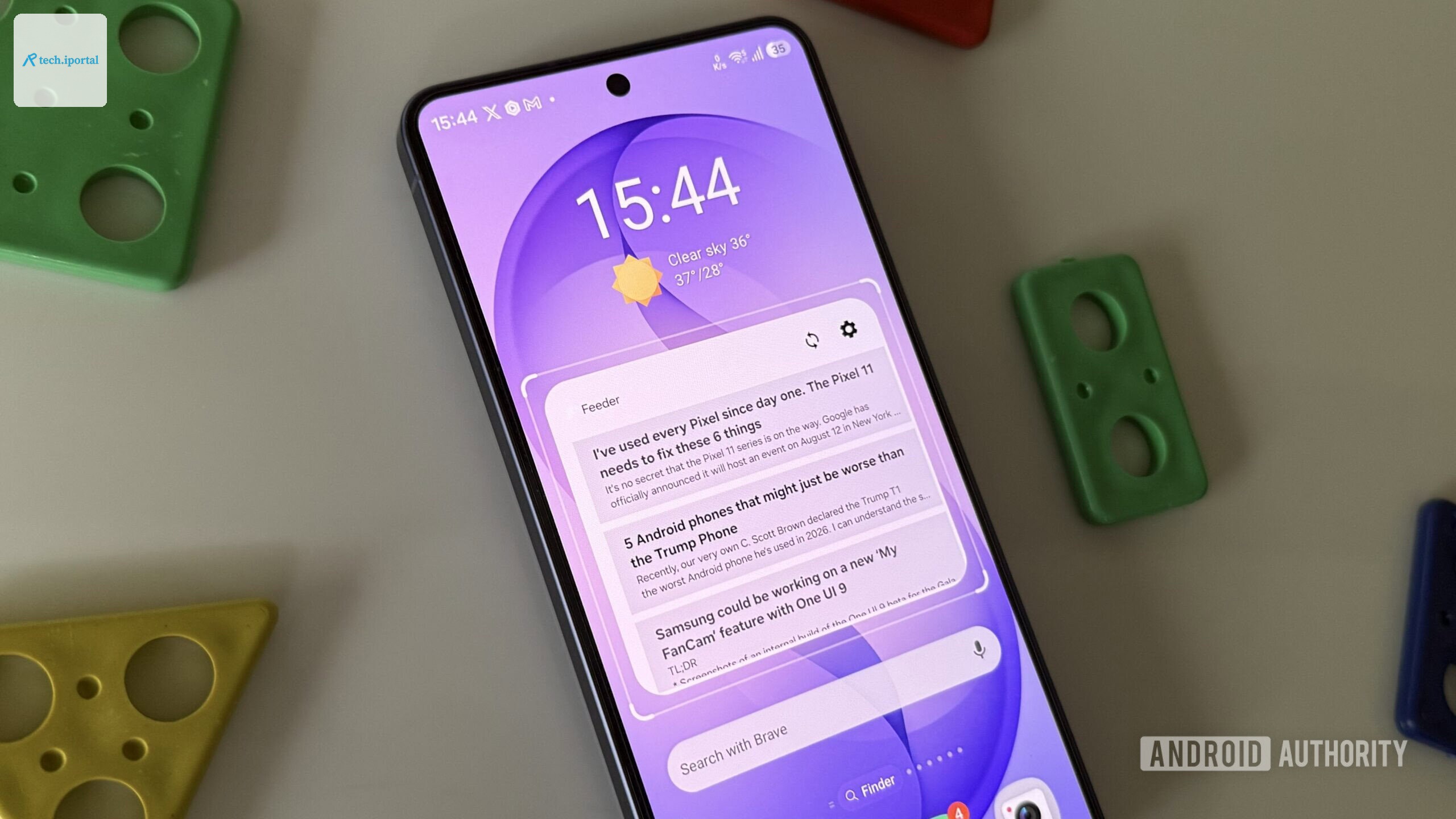 Android phone on a white surface showing Feeder widget