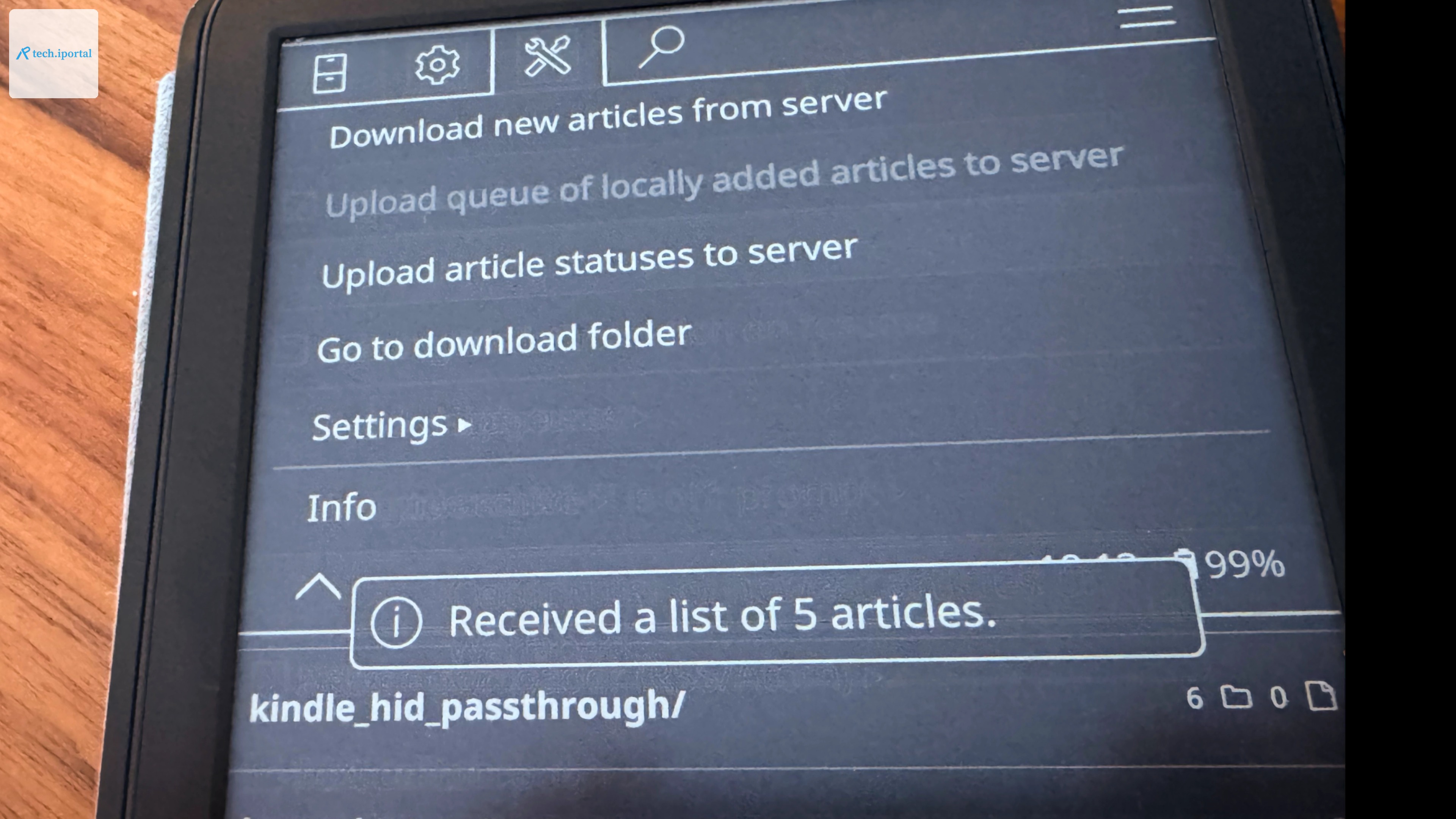 A Kindle, opened to KOReader, with the "Tools" menu selected. On the screen, a toast message reads "Received a list of 5 articles."