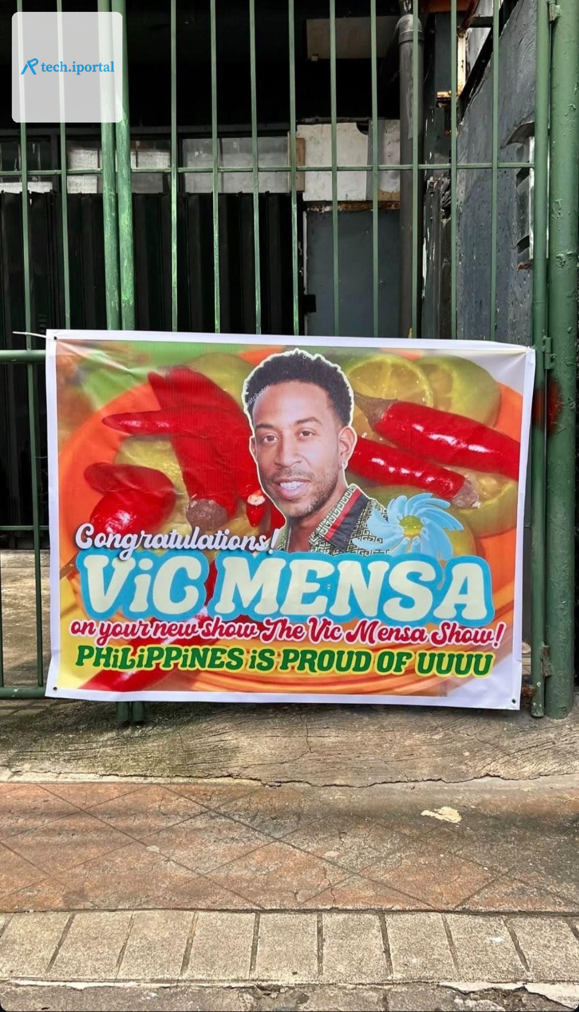 A banner reading “Congratulations ViC MENSA on your new show The Vic Mensa Show! PHiLiPPiNES iS PROUD OF UUUUU” but the picture on the banner is of Ludacris, not Mensa.