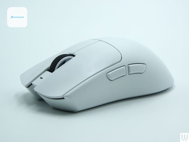 Side of a white computer mouse with a black scrolling wheel two large buttons on top and two small buttons on the left side