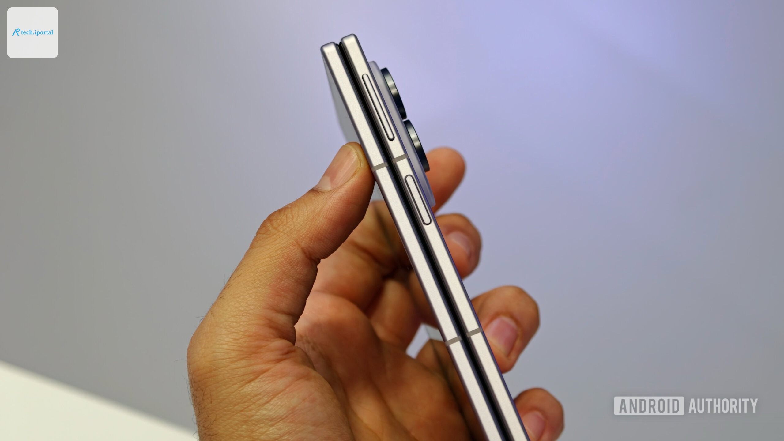 Side profile view of the folded Samsung Galaxy Z Fold 8 held in hand, highlighting its thin frame, power button, and volume rocker