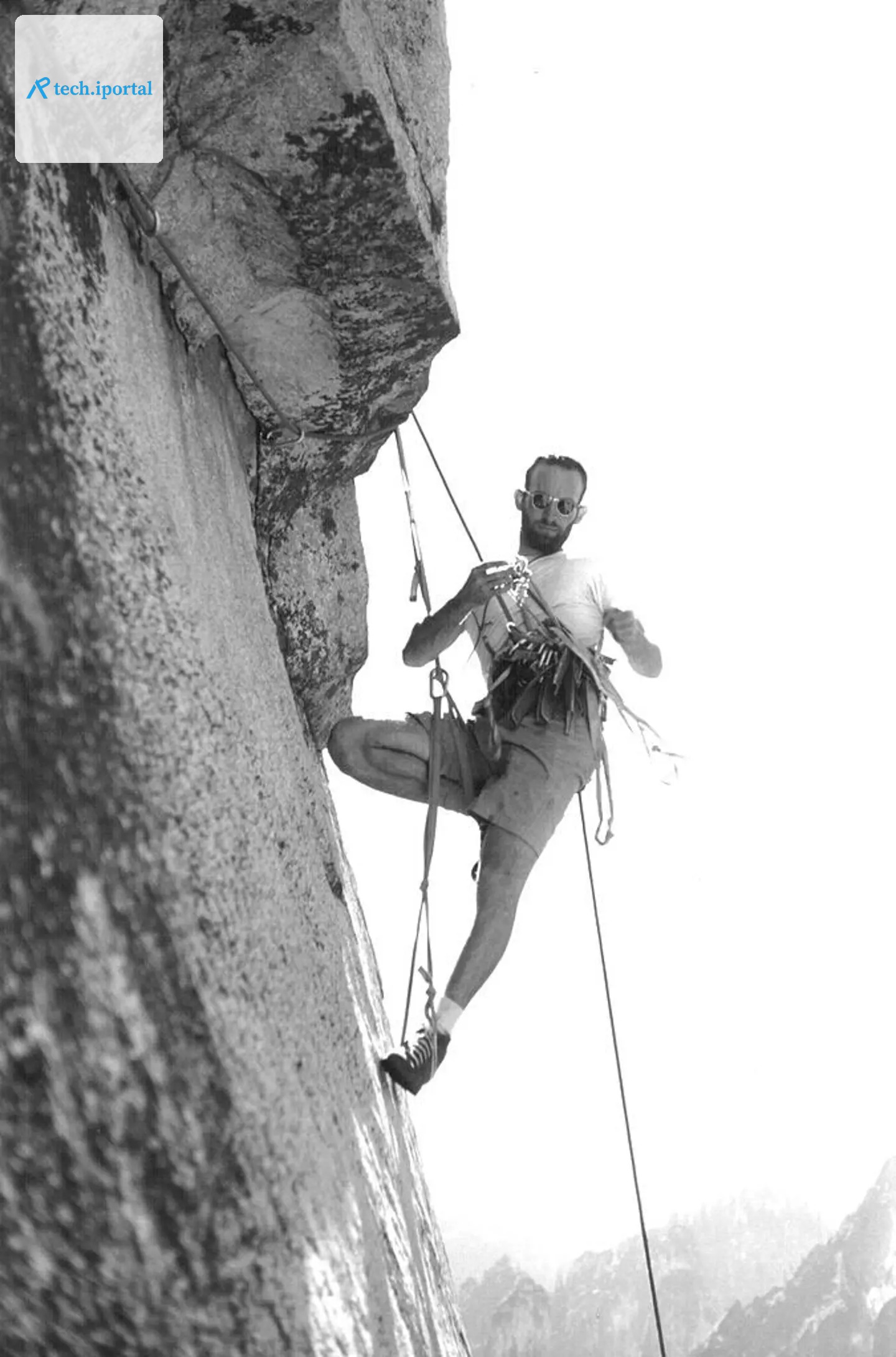 Royal Robbins on El Capitan, his harness racked with the tools of the ascent.