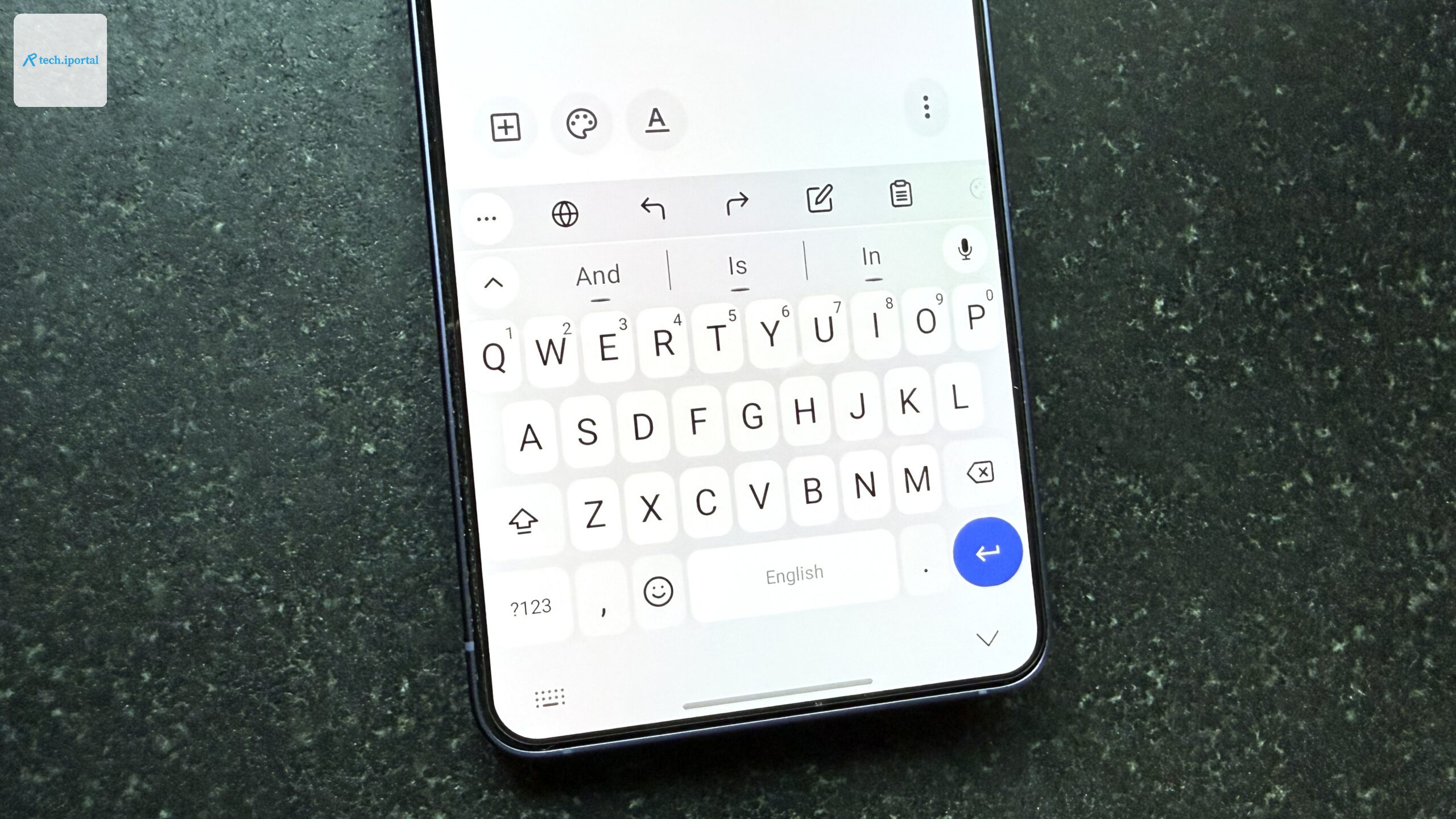 Android phone on a black table top showing FUTO Keyboard