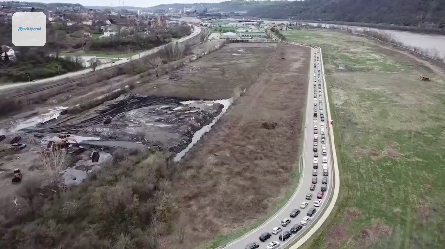 Hundreds of cars line up to visit the Greater Community Food Bank in Duquesne
