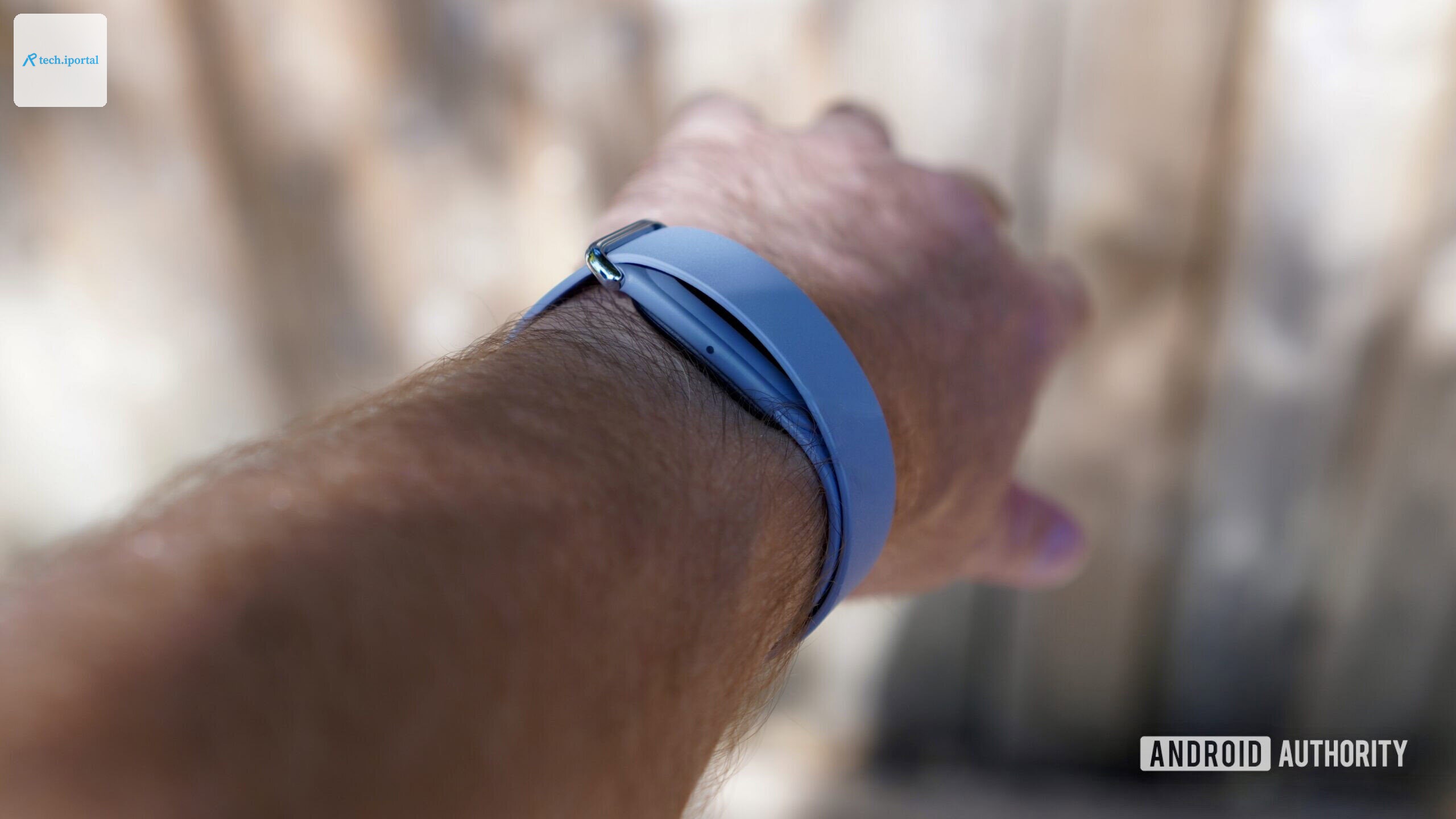 A person wearing a Fitbit Air, showing the side of the device.