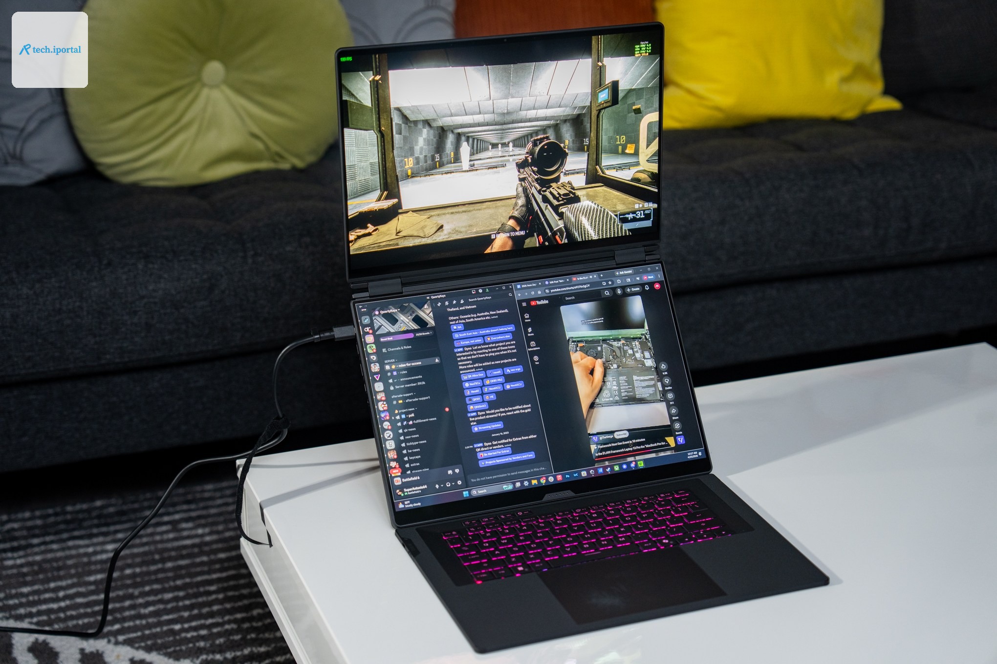 The Asus ROG Zephyrus Duo laptop on a table next to a couch.
