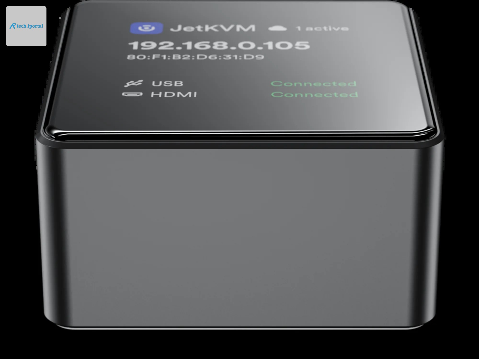 JetKVM Mini from the front, the display showing the IP address and USB and video status