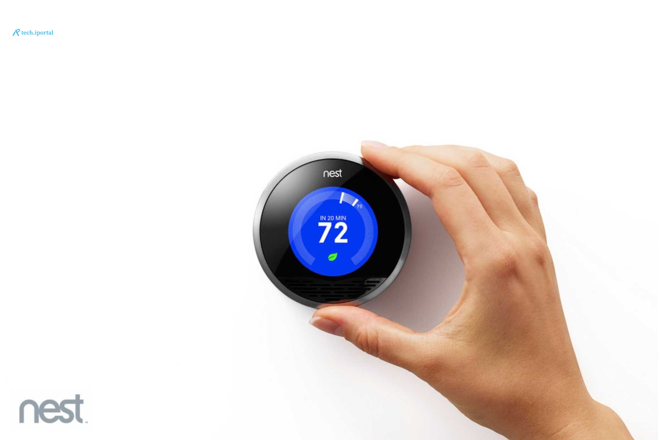 A first-generation Nest learning thermostat in a press image.