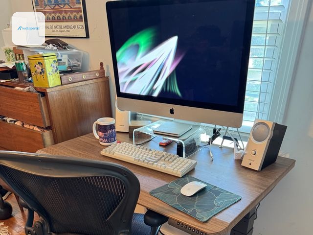 Image may contain Furniture Table Desk Electronics Speaker Computer Computer Hardware Computer Keyboard and Hardware