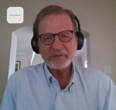 Paul Eggert on a video call, wearing headphones, at home