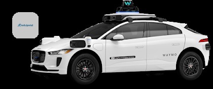 White Waymo self-driving vehicle equipped with LiDAR sensors and cameras on a Singapore street.