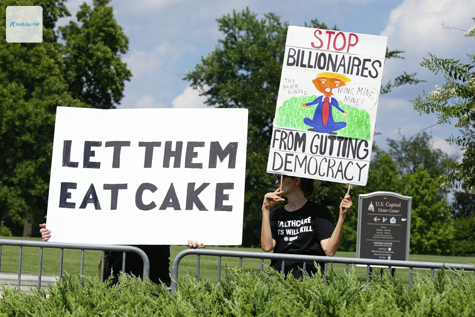 Protesters hold signs opposing President Donald Trump's tax-cut and policy bill on July 2, 2025, in Washington.