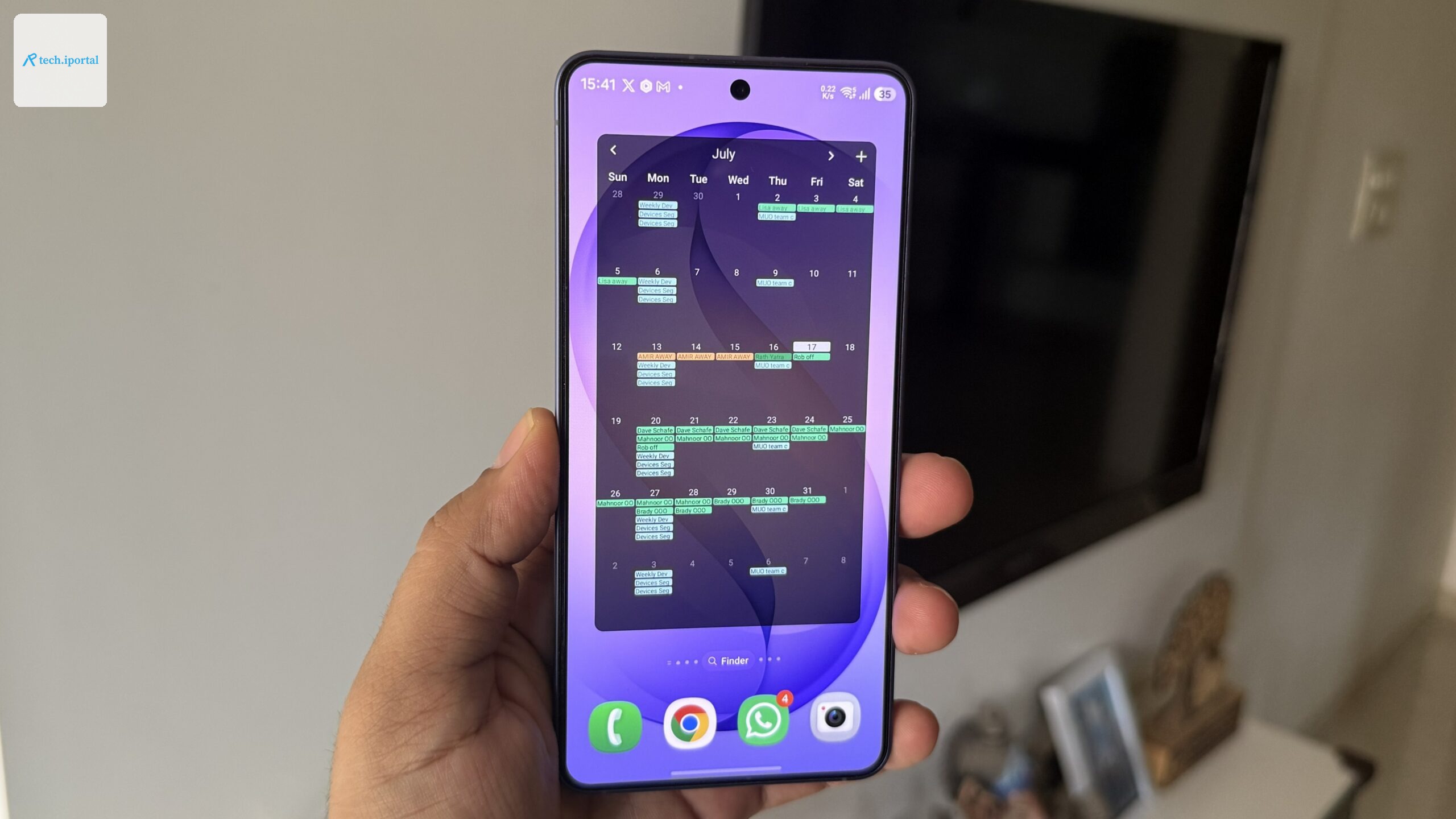 Android phone in hand showing Fossify Calendar widget