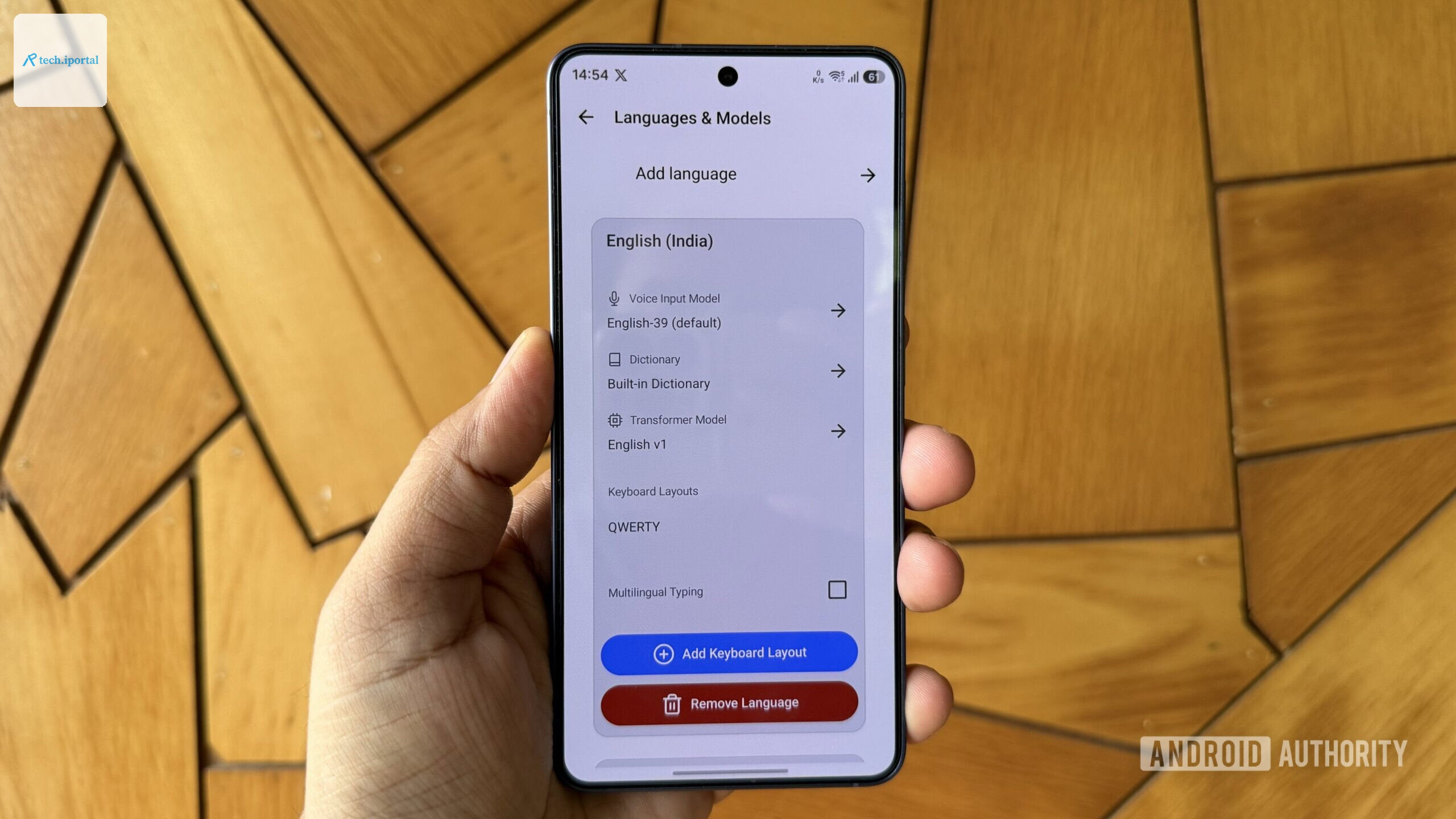Android phone in hand showing FUTO language models