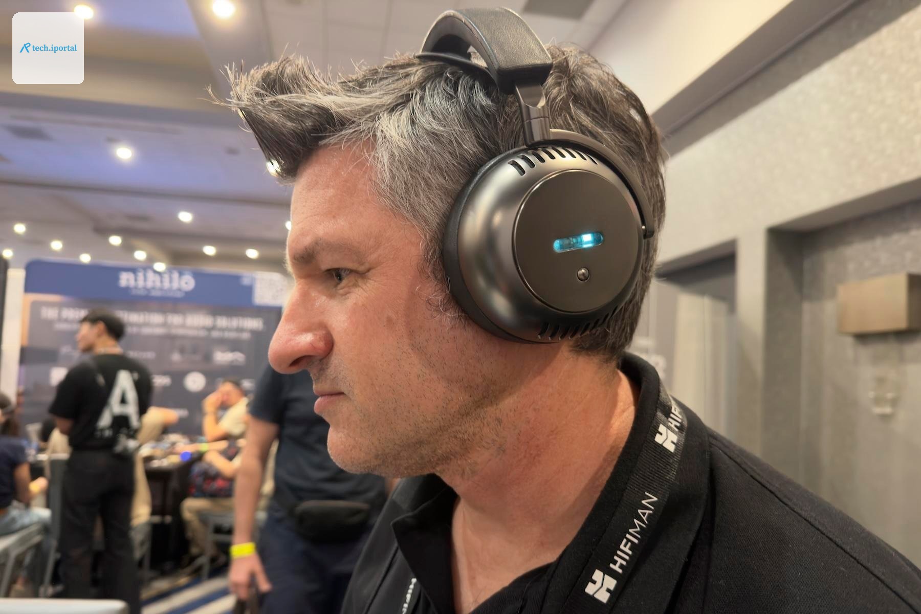 A man listening to the Ecouter TH2 headphones at CanJam SoCal 2026.